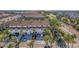 Aerial view of townhome community showing location of property, landscaping, and nearby roads at 262 Madeira Cir, Tierra Verde, FL 33715