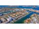 Aerial view of waterfront community with lush landscaping and private boat slips at 262 Madeira Cir, Tierra Verde, FL 33715
