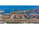Aerial view showing property location, tennis court, and marina at 262 Madeira Cir, Tierra Verde, FL 33715