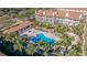 Aerial view of community pool and condo building at 262 Madeira Cir, Tierra Verde, FL 33715