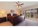Spacious bedroom with a king-size bed and access to a balcony at 262 Madeira Cir, Tierra Verde, FL 33715