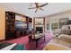 Bright living room featuring a fireplace and comfy seating at 262 Madeira Cir, Tierra Verde, FL 33715