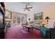 Relaxing living room with a fireplace and plenty of natural light at 262 Madeira Cir, Tierra Verde, FL 33715