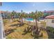 Community pool area with lush landscaping and palm trees at 262 Madeira Cir, Tierra Verde, FL 33715
