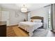 Main bedroom featuring a king-size bed and stylish decor at 3005 Tarabrook Dr, Tampa, FL 33618