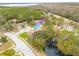 Aerial view showcasing the property's location near a pond at 3143 Brooker Creek Way, Palm Harbor, FL 34685