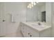 Double vanity bathroom with mirror and light at 3143 Brooker Creek Way, Palm Harbor, FL 34685