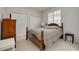 Cozy bedroom with double bed, wooden dresser, and plenty of closet space at 3143 Brooker Creek Way, Palm Harbor, FL 34685
