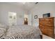Bedroom with zebra patterned bedding and dresser at 3143 Brooker Creek Way, Palm Harbor, FL 34685