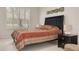 Bedroom with large window and dresser at 3143 Brooker Creek Way, Palm Harbor, FL 34685