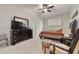 Bedroom with dresser, seating and large window at 3143 Brooker Creek Way, Palm Harbor, FL 34685