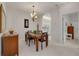 Bright dining room with a granite-topped table and four chairs, adjacent to kitchen at 3143 Brooker Creek Way, Palm Harbor, FL 34685