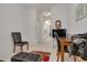 Home office with view into kitchen and hallway at 3143 Brooker Creek Way, Palm Harbor, FL 34685