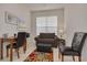 Bright home office features a comfortable sofa, workspace, and ample natural light at 3143 Brooker Creek Way, Palm Harbor, FL 34685