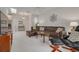 Spacious living room with brown leather sectional sofa and large window at 3143 Brooker Creek Way, Palm Harbor, FL 34685