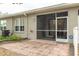 Screened patio with paver stones and access from the living room at 3143 Brooker Creek Way, Palm Harbor, FL 34685