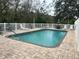 Community pool with plenty of lounge chairs and patio furniture at 3143 Brooker Creek Way, Palm Harbor, FL 34685