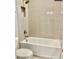 Bathroom with bathtub and tiled walls at 4861 Tramanto Ln, Wesley Chapel, FL 33543