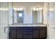 Double vanity bathroom with granite countertop and glass shower at 4861 Tramanto Ln, Wesley Chapel, FL 33543
