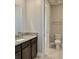 Guest bathroom with toilet and granite vanity at 4861 Tramanto Ln, Wesley Chapel, FL 33543