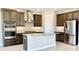 Modern kitchen with stainless steel appliances and island at 4861 Tramanto Ln, Wesley Chapel, FL 33543