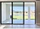 Covered patio overlooking a lake and other homes at 4861 Tramanto Ln, Wesley Chapel, FL 33543