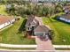 Single-story home with tile roof, large backyard, and two-car garage at 5287 Rushmere Ct, Palmetto, FL 34221