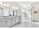 Elegant bathroom with double vanity, large shower, and modern fixtures at 5287 Rushmere Ct, Palmetto, FL 34221