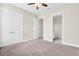 Spacious bedroom with en-suite bathroom and double doors at 5287 Rushmere Ct, Palmetto, FL 34221