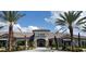 Community clubhouse with attractive landscaping and inviting entrance at 5287 Rushmere Ct, Palmetto, FL 34221