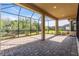 Spacious covered patio featuring a brick paved floor and screened enclosure at 5287 Rushmere Ct, Palmetto, FL 34221