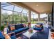 Relaxing covered patio with comfortable seating and view of the backyard at 5287 Rushmere Ct, Palmetto, FL 34221