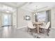 Formal dining area with light wood table and seating for six at 5287 Rushmere Ct, Palmetto, FL 34221