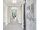 Bright and spacious foyer with tile flooring and view into living area at 5287 Rushmere Ct, Palmetto, FL 34221