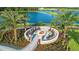 Community fire pit area with seating and landscaping at 5287 Rushmere Ct, Palmetto, FL 34221
