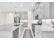 Modern kitchen with gray cabinets, granite countertops and stainless steel appliances at 5287 Rushmere Ct, Palmetto, FL 34221
