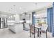 Eat-in kitchen, gray cabinets, granite island, stainless steel appliances at 5287 Rushmere Ct, Palmetto, FL 34221