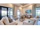 Relaxing lounge with comfortable seating, large windows, and a TV at 5287 Rushmere Ct, Palmetto, FL 34221