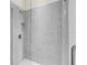 Large walk-in shower with gray tile and glass door at 5287 Rushmere Ct, Palmetto, FL 34221