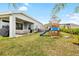 Large backyard with playground, patio, and hot tub at 6189 Hidden Branch Dr, Apollo Beach, FL 33572