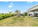 Backyard view featuring a playground set at 6189 Hidden Branch Dr, Apollo Beach, FL 33572