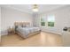 Spacious bedroom with a large bed, neutral color palette, and plenty of natural light at 6189 Hidden Branch Dr, Apollo Beach, FL 33572
