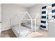 bedroom with two twin beds and navy blue accents at 6189 Hidden Branch Dr, Apollo Beach, FL 33572