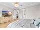 Main bedroom with large TV, ensuite bathroom access, and ample closet space at 6189 Hidden Branch Dr, Apollo Beach, FL 33572
