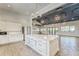 Modern community kitchen with white cabinets and quartz countertops at 6189 Hidden Branch Dr, Apollo Beach, FL 33572