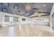Spacious community room with hardwood floors and modern lighting at 6189 Hidden Branch Dr, Apollo Beach, FL 33572