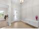 Bright and airy foyer with contemporary console table and art at 6189 Hidden Branch Dr, Apollo Beach, FL 33572