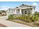 Beautiful two-story home with a three-car garage and well-manicured lawn at 6189 Hidden Branch Dr, Apollo Beach, FL 33572