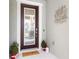 Inviting front entry with modern door and decorative wall art at 6189 Hidden Branch Dr, Apollo Beach, FL 33572