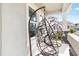 Relaxing front porch with two hanging chairs and lush greenery at 6189 Hidden Branch Dr, Apollo Beach, FL 33572
